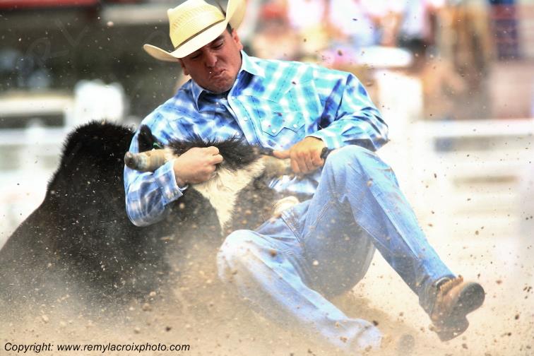 Rodeo Cheyenne Frontier Days steer-wrestling Wyoming USA www.remylacroixphoto.com